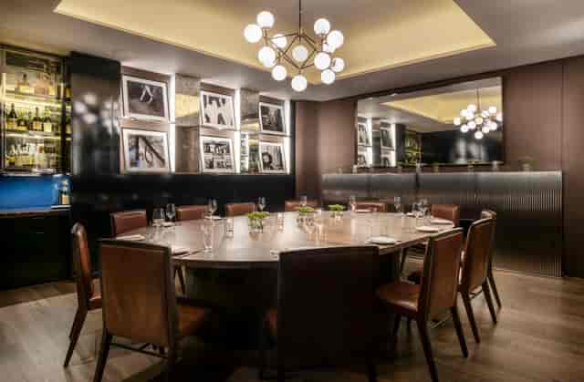 Private dining room in Sette with elegant decor, ideal for exclusive events and meetings.