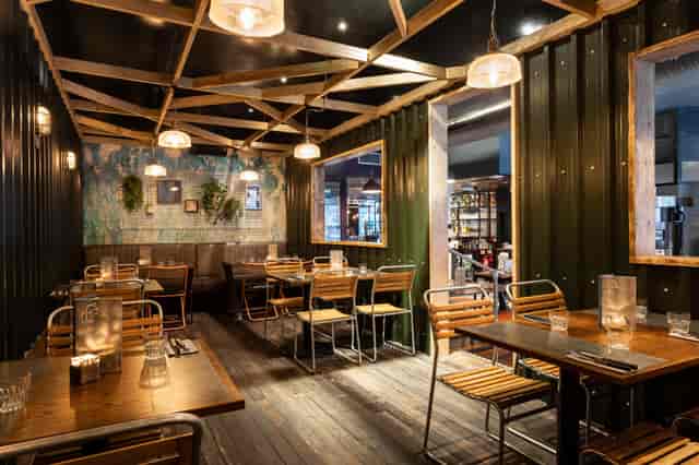 Stylish restaurant venue with warm lighting, ideal for intimate meetings and events.