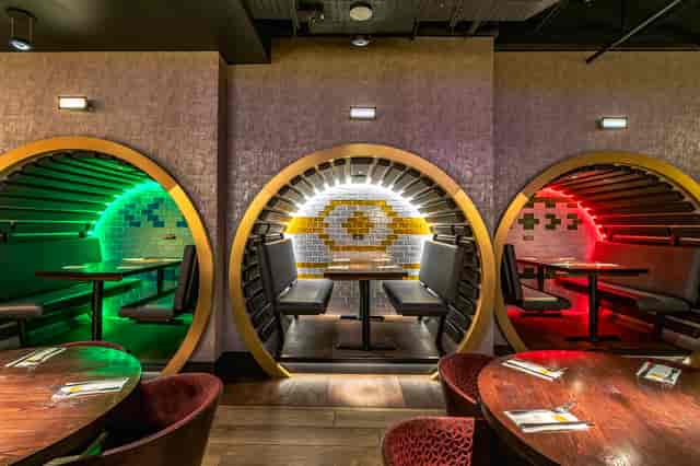 Vibrant dining space with circular booths at Hard Rock Cafe Piccadilly Circus for events.