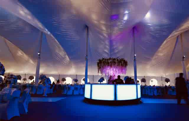 Elegant Mega Marquee event tent with stylish bar, perfect for upscale gatherings.