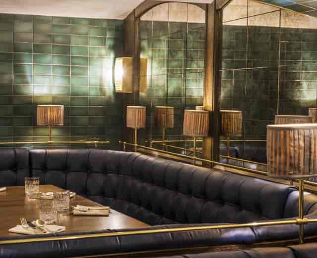 Sloane Place Bar: elegant dining with plush seating, perfect for upscale events and gatherings.