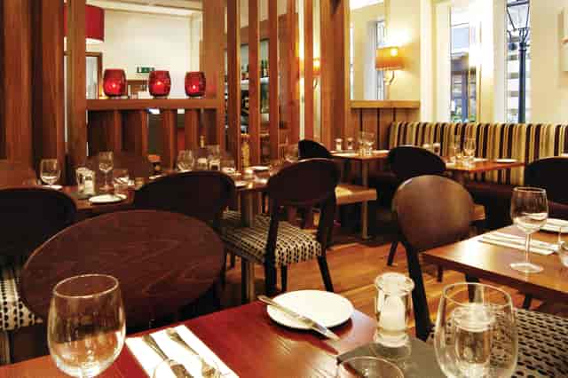 Intimate restaurant space in Thistle Bloomsbury Park for upscale dining and corporate events.