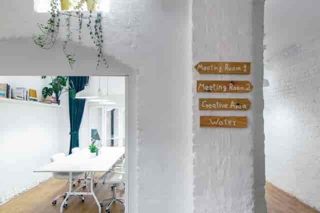 Bright meeting space at Cobalance Cafe with clear signage for productive events.
