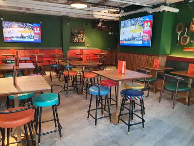 Vibrant event space at Redwood Sports Pub for watch parties and networking events.