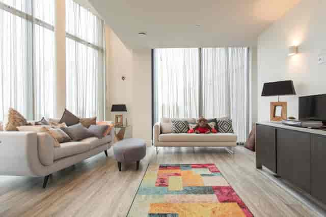 Modern penthouse lounge for filming and events with stylish furniture and natural light.