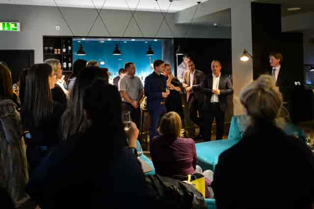 Networking event at The Lampery, stylish venue with engaged attendees and drinks.