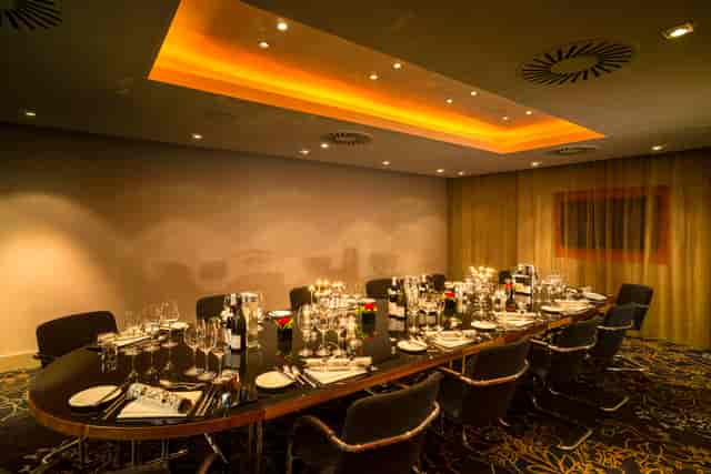 Elegant dining setup in Apex City of London Hotel for corporate events and gatherings.