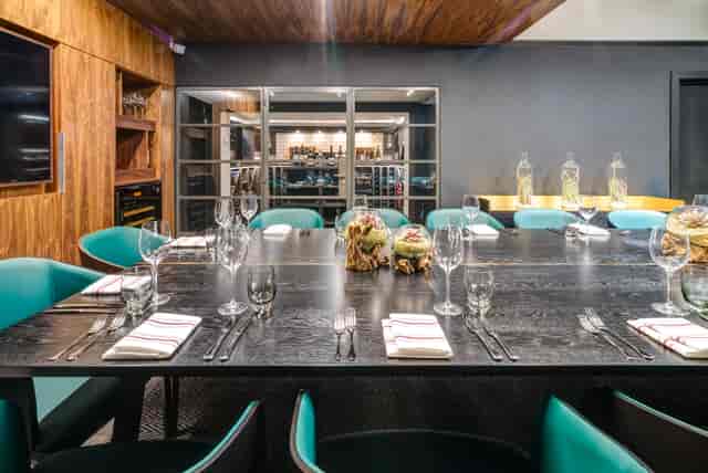 Sophisticated meeting space with dark wood table at Apex Temple Court Hotel.