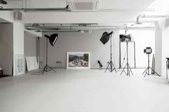Versatile contemporary event space with professional lighting for photo shoots and presentations.