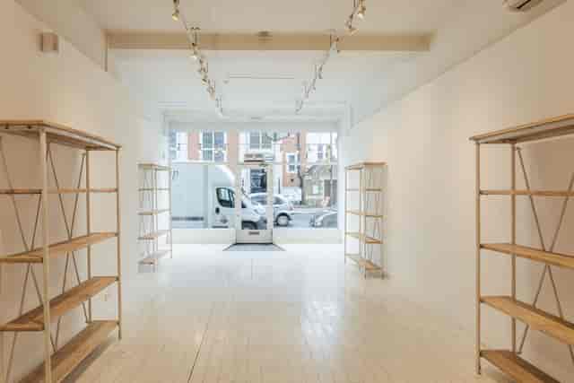Modern event space with natural light, perfect for art exhibits and corporate meetings.
