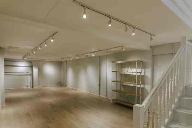 Versatile event space at 725 Fulham Road with natural light, perfect for workshops and receptions.