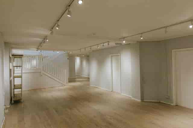 Spacious event venue with wooden flooring for gatherings and workshops at 725 Fulham Road.