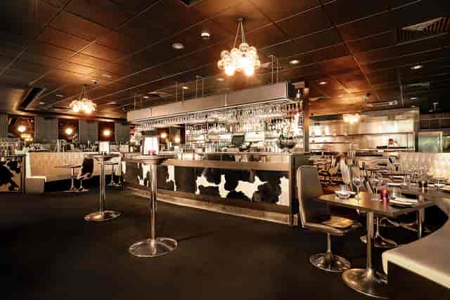Modern restaurant venue with stylish seating, ideal for networking events and private gatherings.