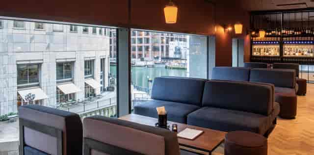 Stylish lounge at The Mezzanine, Vagabond Canary Wharf, perfect for networking events.