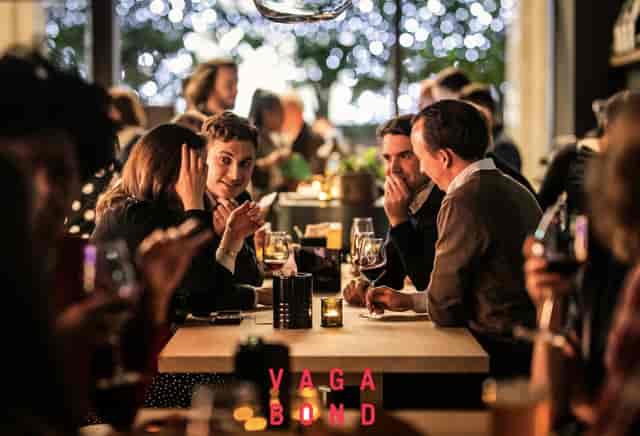 Vibrant networking event at Upstairs Lounge, warm lighting and inviting atmosphere.