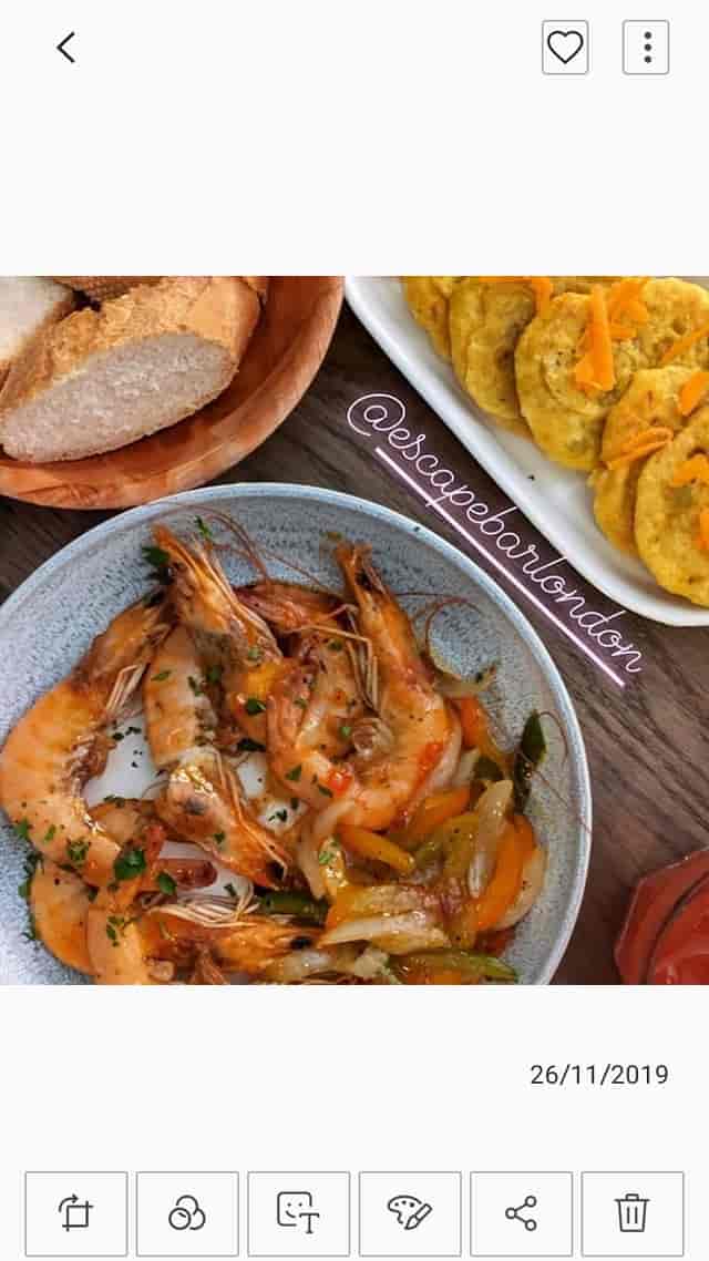 Elegant shrimp dish with herbs and vegetables at an event venue catering.