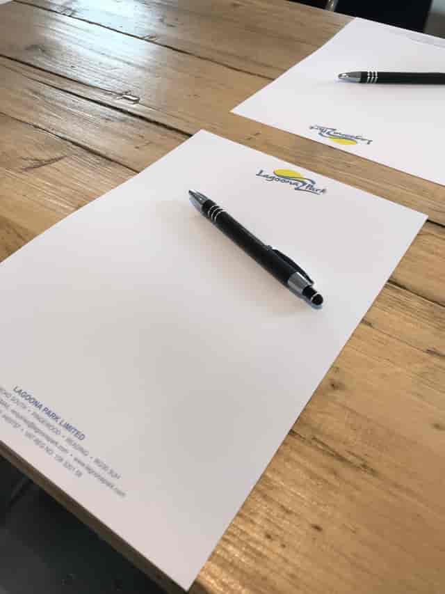 Whole Venue at Lagoona Bar & Grill with branded notepad and pen for meetings.