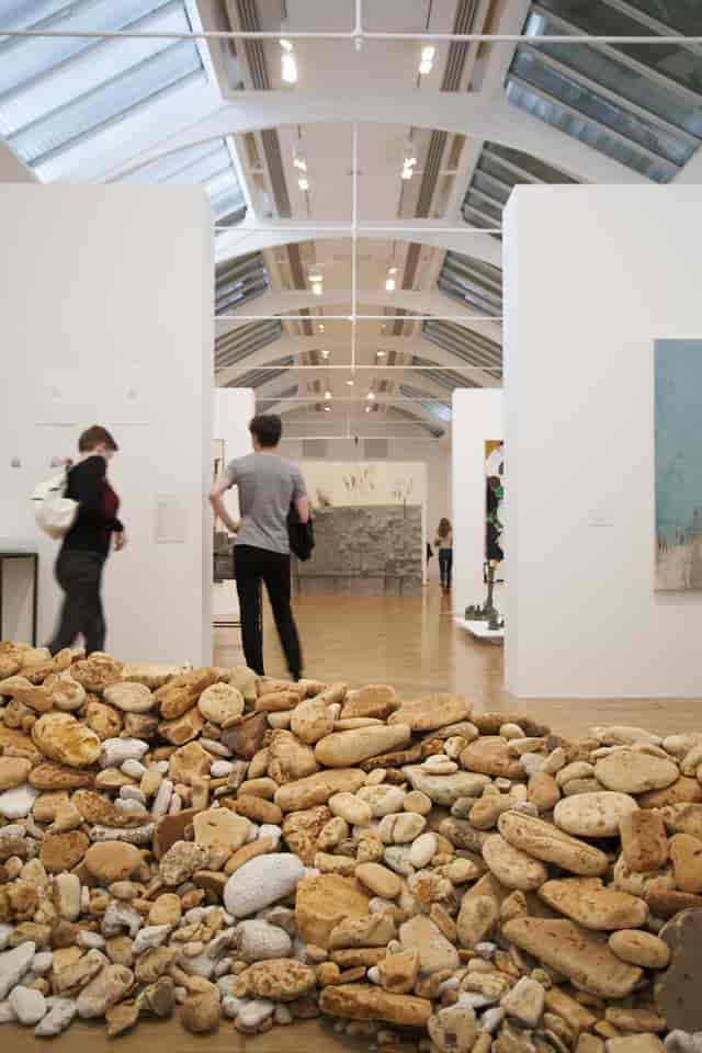 Industrial gallery event space with high ceilings for weddings and corporate receptions.