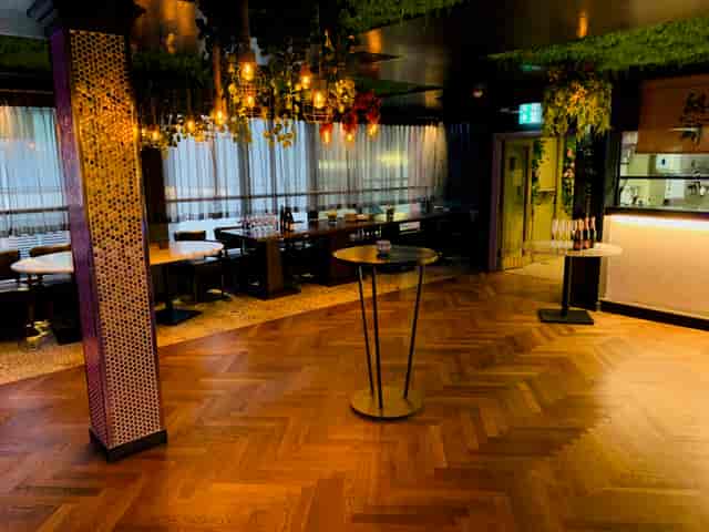 Stylish event space at Kirin Japanese Restaurant with elegant lighting and greenery.
