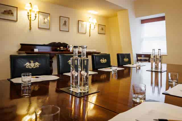 Pitt Library meeting room with polished table, ideal for professional gatherings and events.