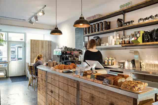 Cozy Cafe Broadway Market with rustic decor, ideal for networking events and meetings.