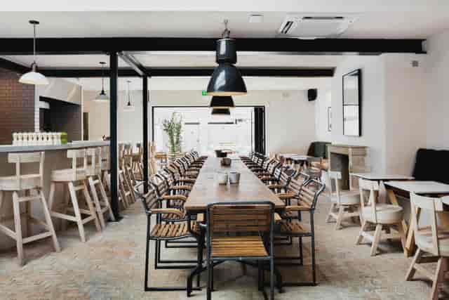 Industrial-chic semi-private dining area at The Pilot for corporate dinners and workshops.