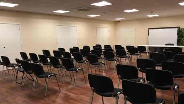 St Katherine Conference Hall setup for a professional workshop with black chairs.
