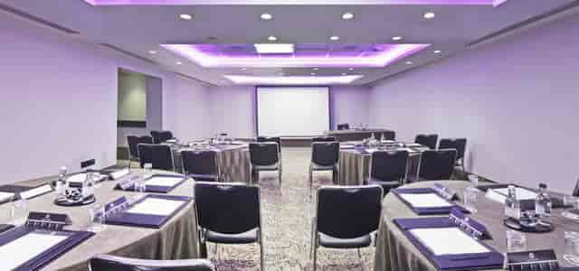 Titchfield Suite meeting room with round tables, ideal for professional events and networking.