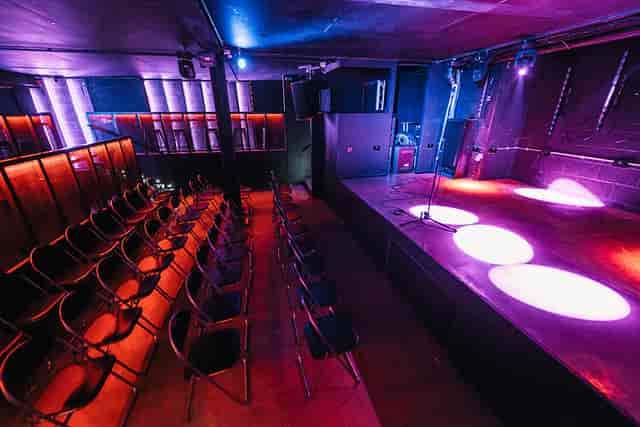 Main room at Peckham Audio with stage lighting for versatile events and performances.