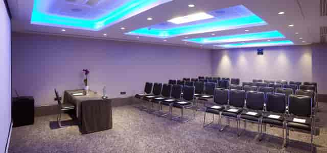 Langham Suite meeting room with long table, ideal for professional events and conferences.