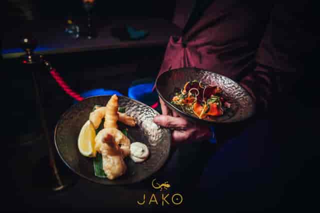 Sophisticated lounge area catering setup with elegant dishes for upscale events in Jako London.