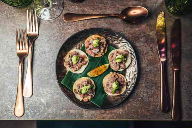 Elegant gourmet appetizers in Jako London's lounge area for upscale events.
