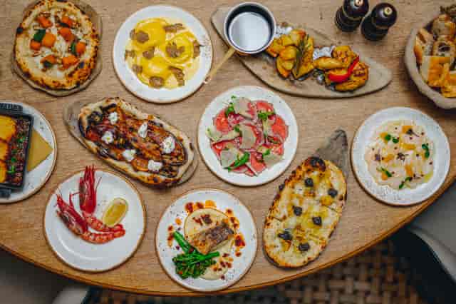 Exclusive Venue Hire at TOZI Restaurant: colorful dishes for upscale catered events.