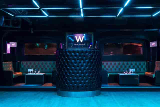 Whole Venue at Why Not Nightclub: modern event space with vibrant blue lighting for parties.
