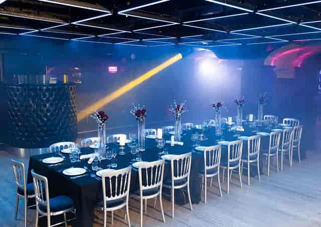 Elegant dinner setup at Why Not Nightclub for corporate events and upscale gatherings.