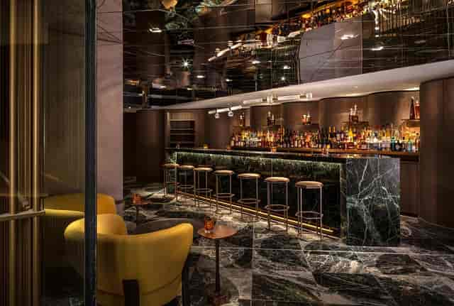 Sophisticated bar in The Londoner's Green Room, ideal for networking events and cocktail receptions.