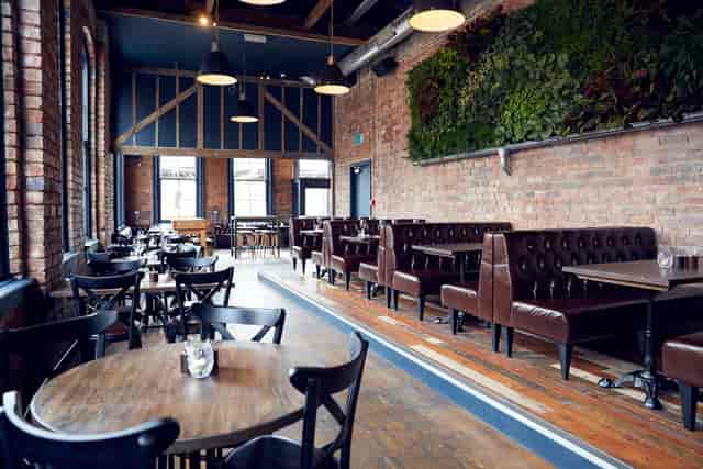 Stylish Upstairs Bar with rustic decor, perfect for networking events and casual meetings.