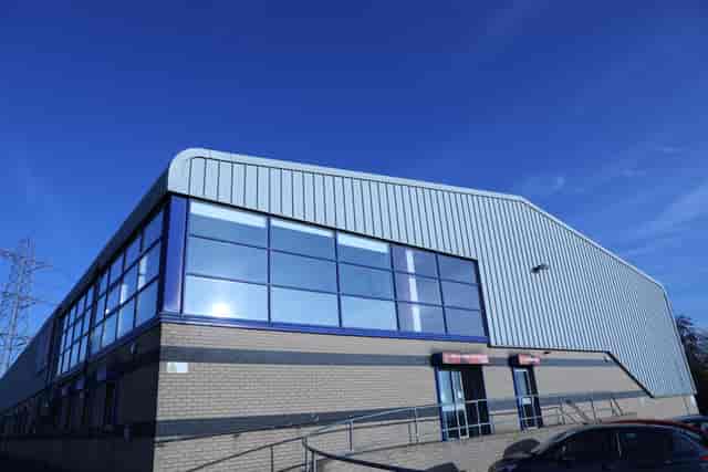 Modern auditorium with large windows, ideal for corporate events and exhibitions.