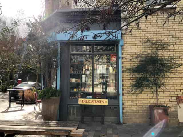 Charming Italo Delicatessen venue with outdoor seating for intimate gatherings and events.