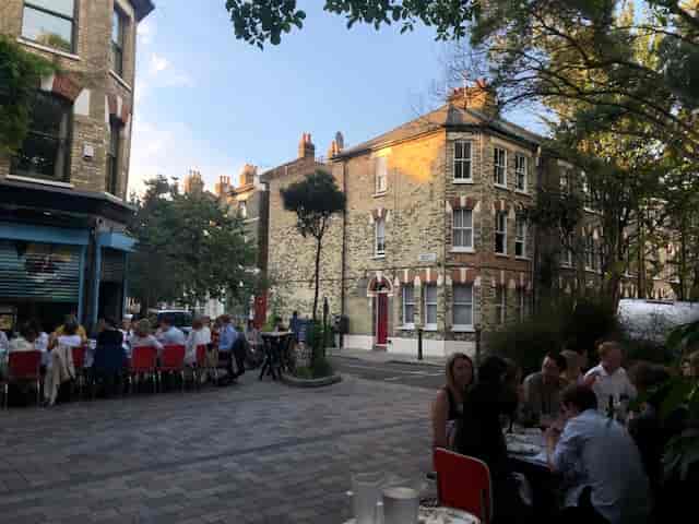 Outdoor dining setup at Italo Delicatessen, perfect for networking events and gatherings.