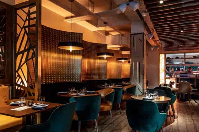 Stylish restaurant interior at Farzi London, ideal for intimate meetings and events.