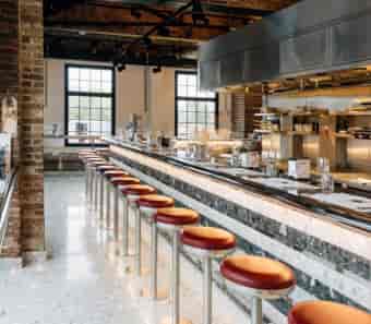 Private dining room at Barrafina Coal Drops Yard, modern kitchen for culinary events.