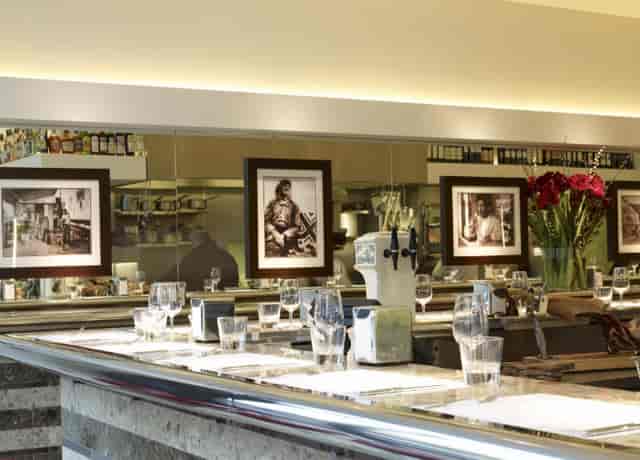Private dining room at Barrafina Dean Street, elegant bar, ideal for upscale events.