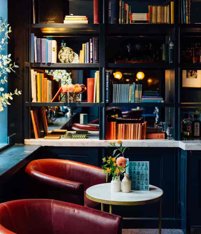 Cozy library space with elegant decor for intimate meetings and networking events.