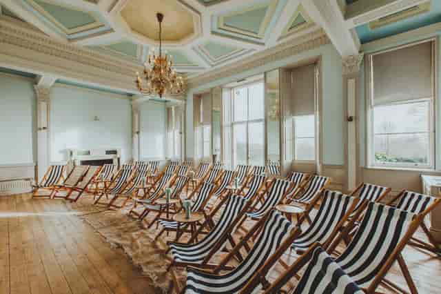 Stylish meeting space with striped deck chairs for creative workshops and brainstorming sessions.