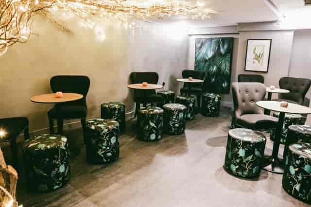 Sandy's Piano Bar event space with cozy seating, ideal for meetings and receptions.