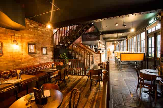 Stylish Gin Snug venue with exposed brick, perfect for gatherings and events in Birmingham.