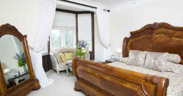 Elegant bedroom at Berwick Lodge, perfect for intimate retreats and VIP events.