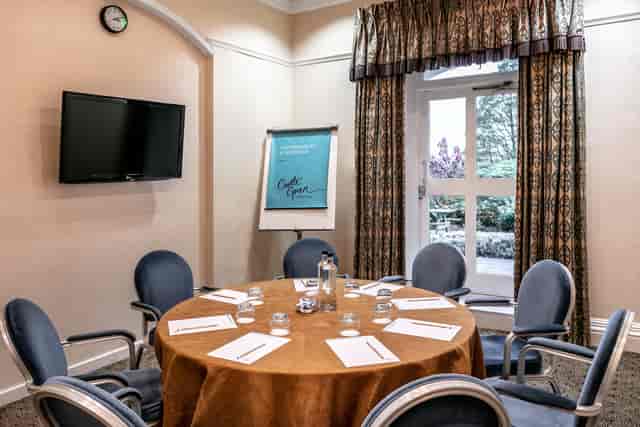 Bindloss Room at Castle Green Hotel, ideal for meetings with natural light and round table.
