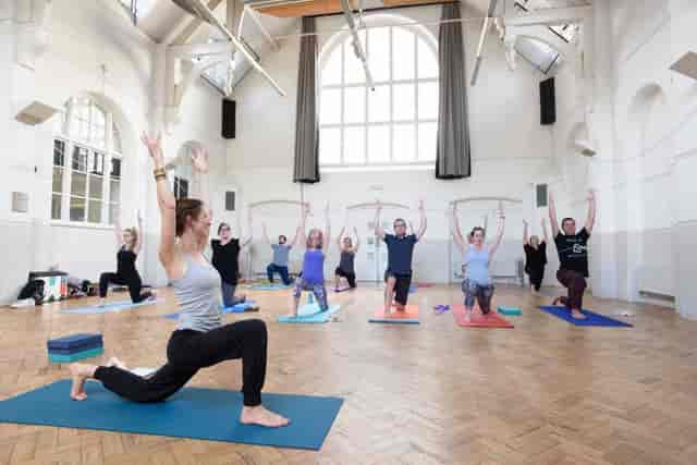 Group yoga session at Milford Hall, spacious venue for wellness events and retreats.